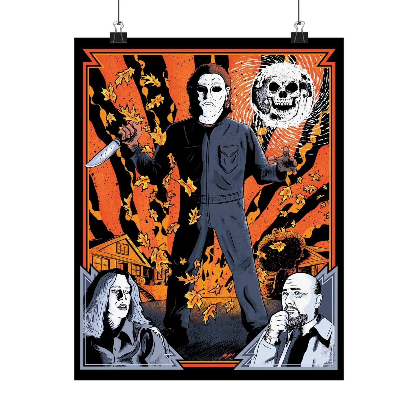 An 11" x 14" matte poster hanging from two clips. The poster features an original illustration from Glow Bat Horror Designs and shows Michael Myers, Laurie Strode (Jamie Lee Curtis) and Dr. Loomis (Donald Pleasance) from the 1978 horror film Halloween on a autumn street with a skull moon and fall leaves