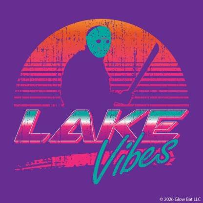 An orange sunset and Jason Vorhees in front of it in silhouette and the words "Lake Vibes" underneath in a retro 80s style on a purple background by Glow Bat Alternative Fashion